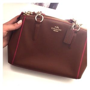 Coach light brown & bright pink accented hand bag